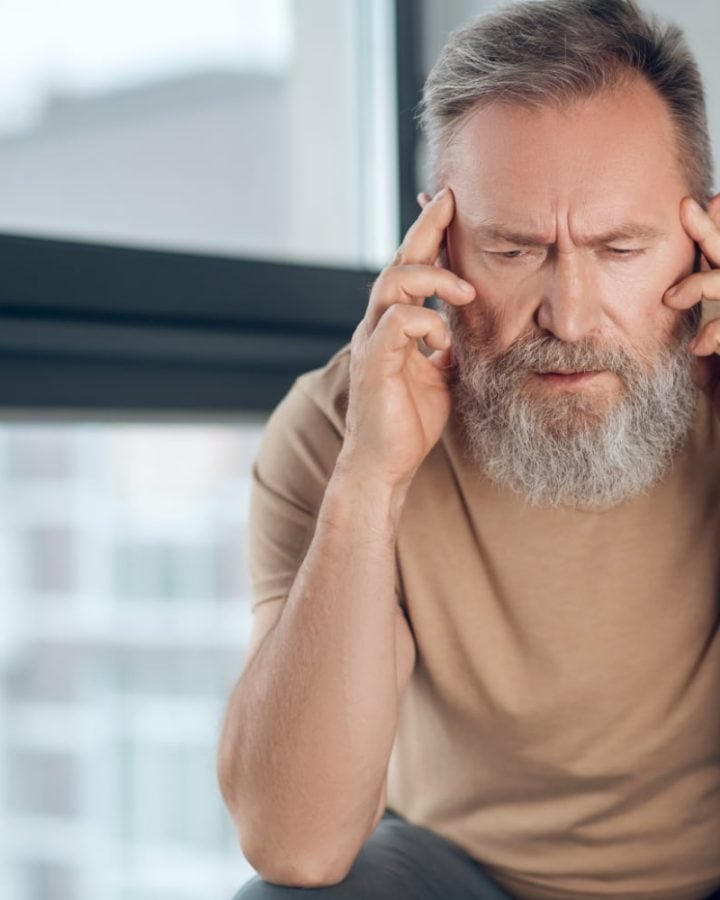 man suffering from headache