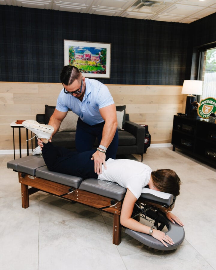 Chiropractic adjustment on the treatment bench at Forza Chiropractic